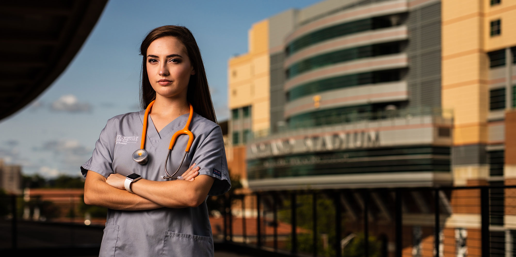 University of Tennessee nursing student in front of Neyland Stadium