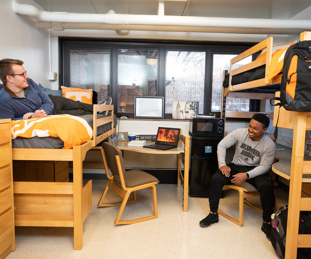 Students hanging out in their dorm room on campus.