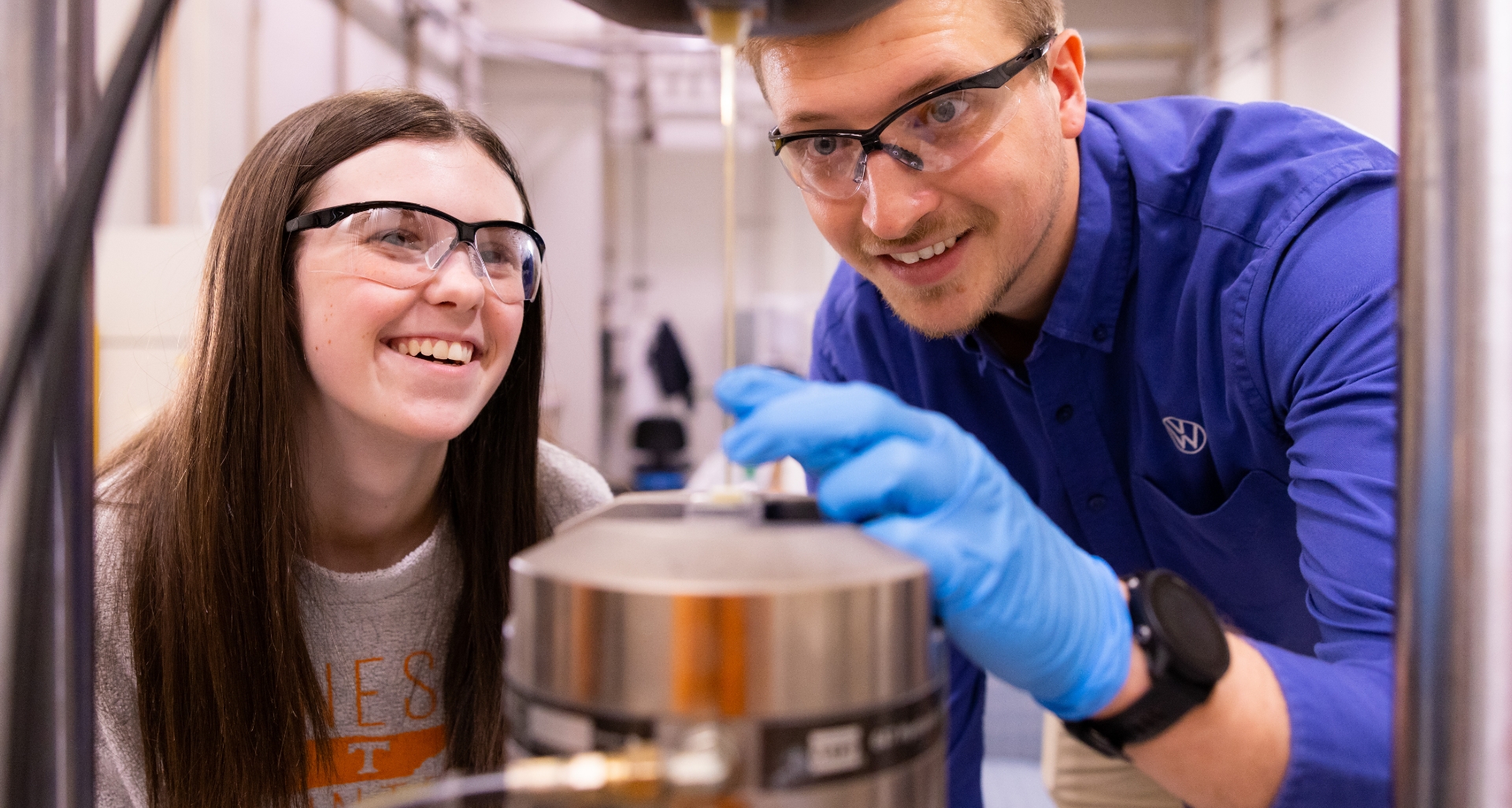 Students conducting research in a lab. 