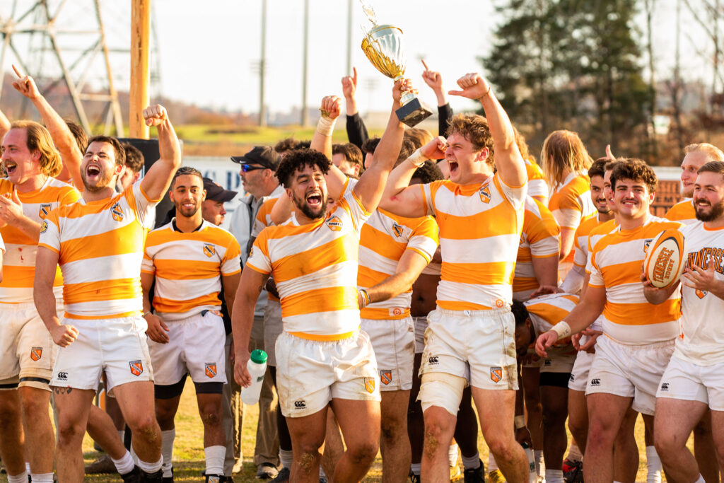 the rugby team celebrates after a win at the Southeastern Collegiate Rugby Conference