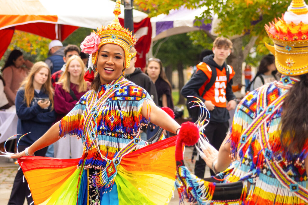 Brightly colored Thai dancers perform during the International Festival