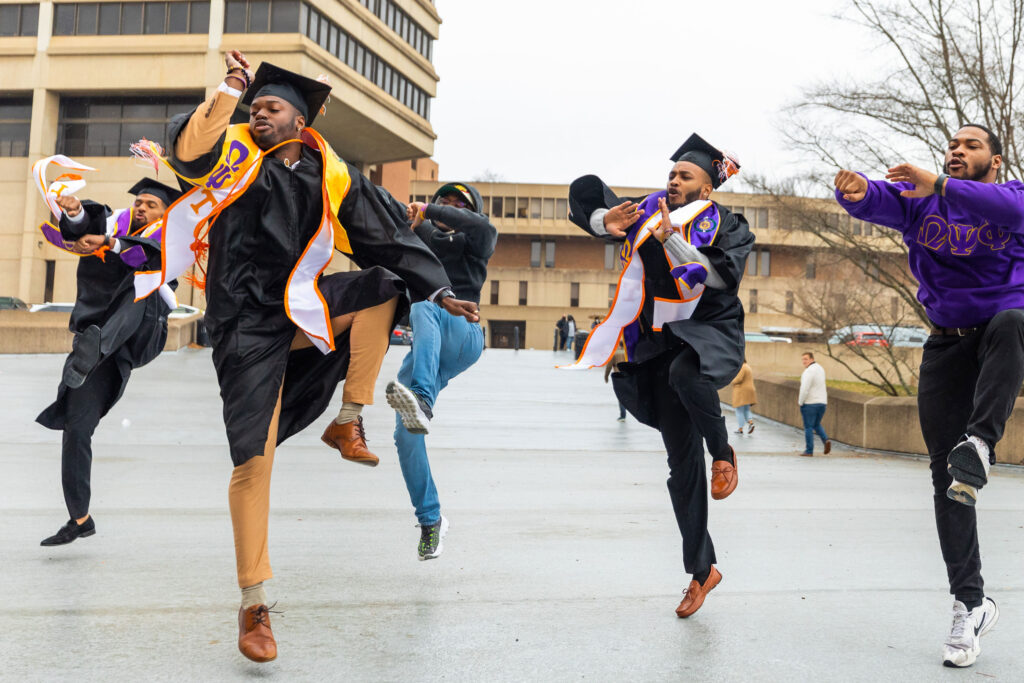 Recent graduates dance and celebrate after the graduation ceremony