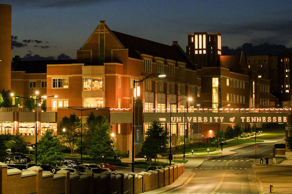 At night the Student Union stands brightly lit at the center of campus
