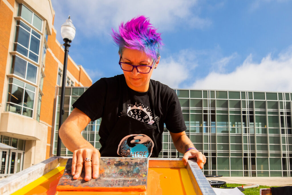 Screenprinting on campus outside on a beautiful day