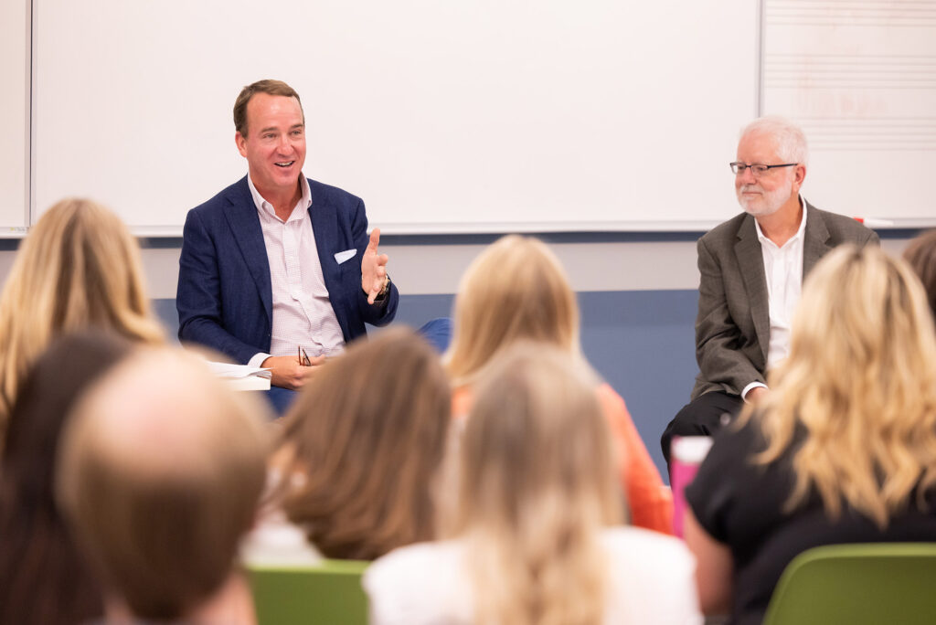 Peyton Manning speak to a class