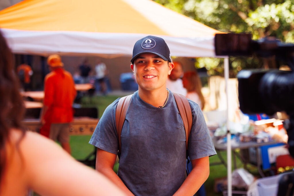 A student is interviewed during a campus event