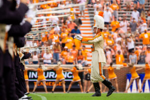 Drum major leads the band during a halftime performance